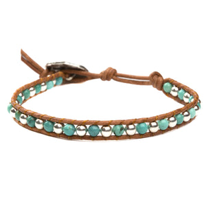 Women's wrap bracelet with turquoise gemstones and sterling silver on natural leather